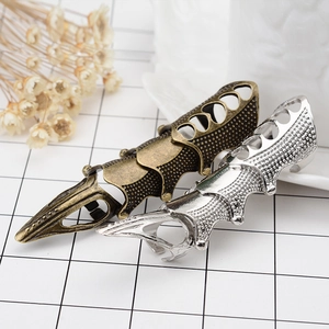 Mechanical gothic armor rings in bronze and silver with heart cutouts and metal studs