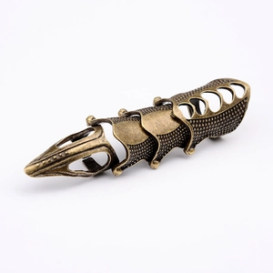 Macro detail of gothic bronze armor ring featuring a four-segment hinged joint structure