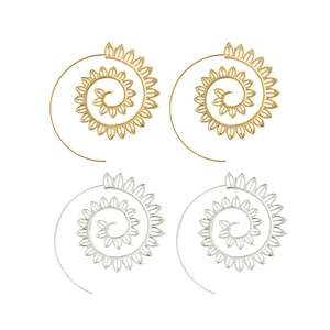 Detail view of gold and silver spiral leaf earrings with bohemian textured edges