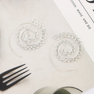 Silver spiral leaf earrings with sunflower hollow design for women in a lifestyle view