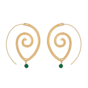 Detail view of gold spiral leaf earrings with green faceted gemstone drops