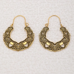 Vintage hollow flower hoop earrings with intricate gold-finish bohemian lace patterns