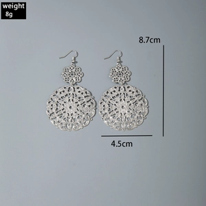 Detailed view of silver hollow floral earrings with 8.7cm length and 8g weight specs