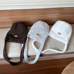 Vintage plush faux fur bucket bags in coffee, grey, and white with soft wide shoulder straps