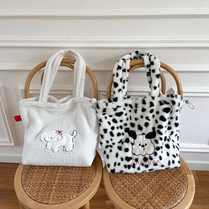 Detailed plush texture and puppy embroidery on white and spotted fluffy tote bags