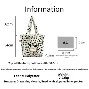 Size comparison of plush dalmatian print tote bag with embroidered dog and A4 paper scale