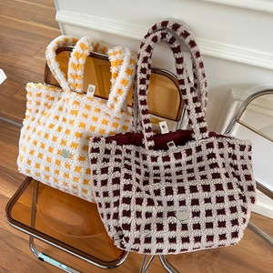 Winter plush checkerboard tote bags in cream colors featuring a heart metal logo plate