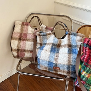 Detail of soft plush plaid tote bags with Star-picking leather tags and nylon straps