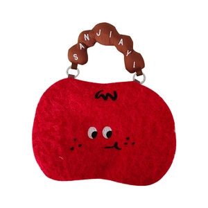 Cute red plush cartoon handbag with embroidered eyes and brown padded top handle