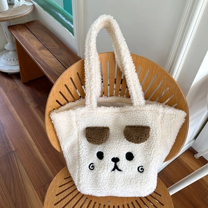 Detailed close-up of the plush bear tote bag featuring 3D ears and cute facial embroidery