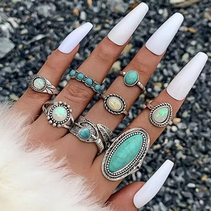 Retro Bohemian 8-piece ring set with turquoise and opal stones on vintage silver metal