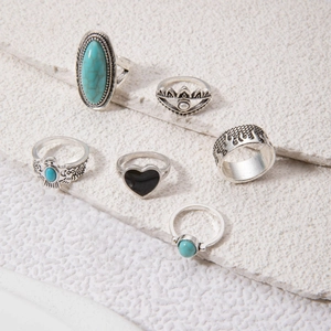 Detail of 6pcs bohemian silver rings with turquoise, elephant relief and tribal carvings