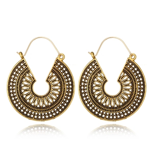 Bohemian vintage hollow carved metal drop earrings with ethnic geometric patterns