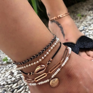 Five-piece multilayer beach anklet set with golden shells, beads, and paperclip chains