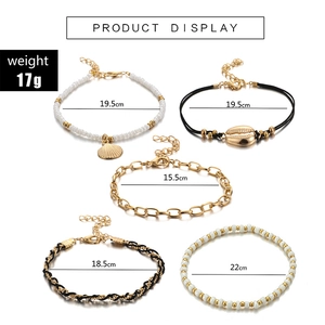 Five-piece Bohemian shell anklet set with gold beads and woven cord for beach vacation