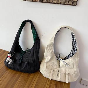 Vertical pleated nylon tote bags in black and beige with front pockets and plaid lining