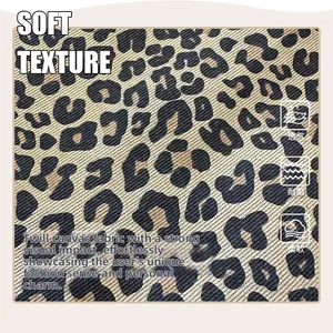 Close-up of leopard print canvas fabric showing high-quality twill texture and soft weave