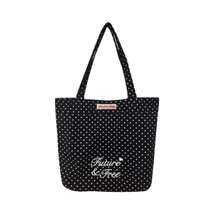 Black canvas tote bag with white polka dots featuring Future & Free heart graphic