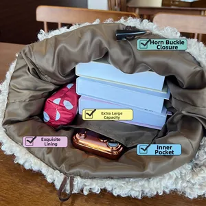 Internal view of high-capacity plush tote bag with horn buckle and inner pocket detail