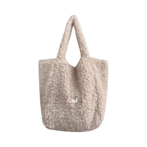 Plush lamb wool tote bag for women in soft beige pink with metallic logo detail