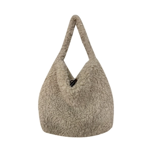Chic beige faux shearling tote bag with a dark toggle closure for autumn and winter fashion