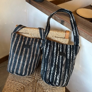 Chic woven knit crossbody bag with vertical black and brown stripes for autumn fashion