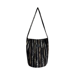 Chic knit bucket bag with colorful wavy stripes and adjustable single shoulder strap