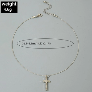 Detail of silver cross pendant necklace with zircon inlay and lobster clasp