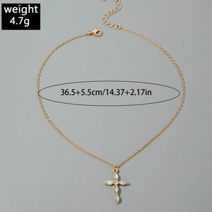 Detail of gold cross pendant with marquise zircons and lobster clasp showing 4.7g weight