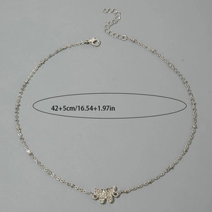 Detail of silver butterfly pendant necklace with sparkling rhinestones and adjustable clasp