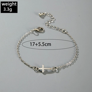 Silver cross bracelet detail showing lobster clasp, extender chain and 17+5.5cm length measurement