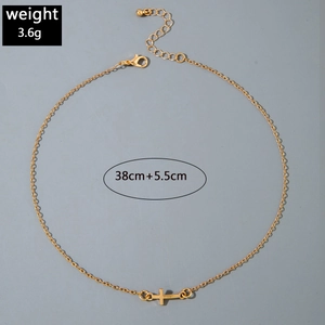 Detail of gold cross pendant with adjustable chain and dimensions for jewelry