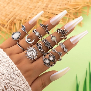 Close-up of 13-piece vintage bohemian ring set featuring sun moon and gemstone motifs
