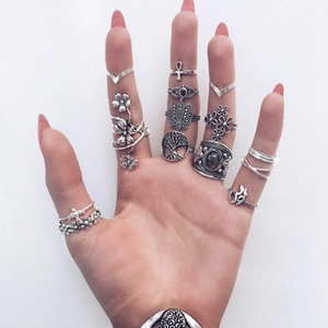 Vintage silver ring set featuring bohemian drop-shaped gemstones and floral patterns