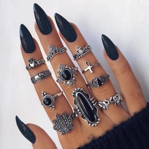 Detailed view of bohemian silver ring set with vintage gemstones on hand