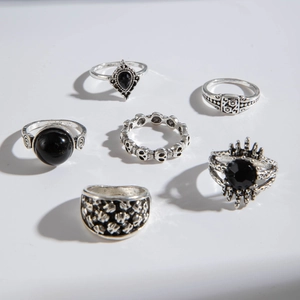 Detailed view of 6-piece vintage silver gothic ring set with teardrop black gemstones