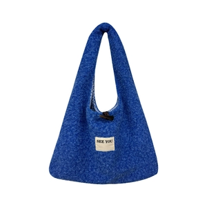 Minimalist Klein blue fuzzy tote bag with toggle closure and SEE YOU logo patch