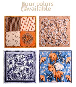 Flat lay of four elegant square silk scarves featuring distinct geometric and floral patterns