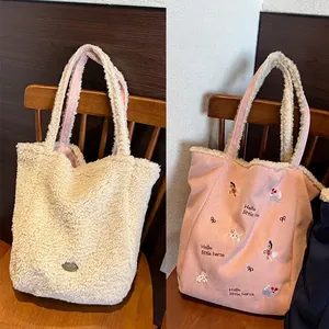 Bolso tote reversible de forro polar y lona rosa con bordado de un caballo