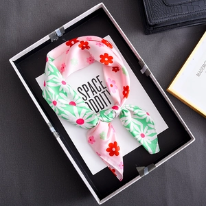 Floral silk scarf with daisy patterns and pink contrast design in a display box