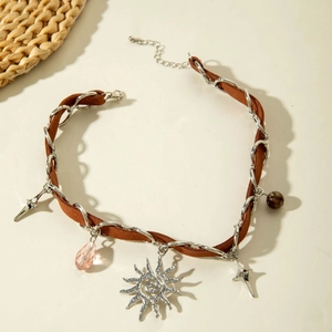 Detail of gothic snake velvet choker with sun and star pendants and silver chain