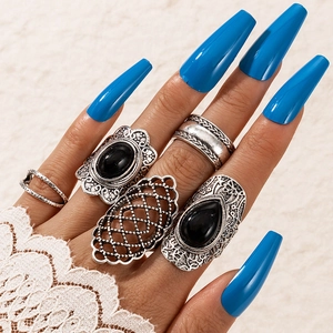 5-piece vintage bohemian silver ring set with turquoise and black gemstones on model