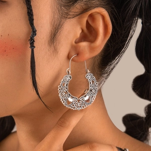 Bohemian vintage hollow silver flower hoop earrings with intricate floral petal patterns