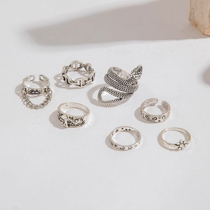 Detailed view of 7-piece vintage silver snake and celestial themed punk ring set
