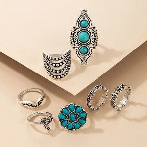 Macro view of silver alloy elephant rings with turquoise stones in bohemian style