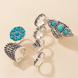 7-piece vintage silver ring set featuring turquoise stones and bohemian elephant motifs
