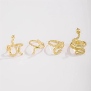 Detailed view of four vintage gold snake rings with intricate scale textures and patterns