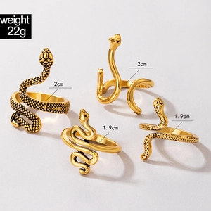 Detail view of 4-piece vintage gold snake ring set with realistic scale texture details