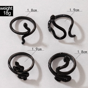 Detailed view of four black punk snake rings with scale texture and size measurements