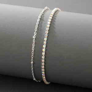 Double-layered silver anklet featuring a minimalist chain and a vibrant colorful rhinestone link